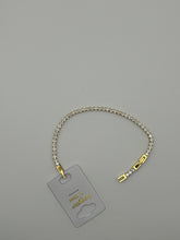 Bracciale tennis bianco e dorato